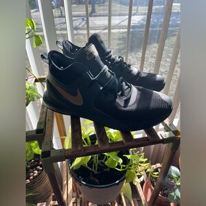 Nike Men’s Black Sneakers with Gold Swoosh